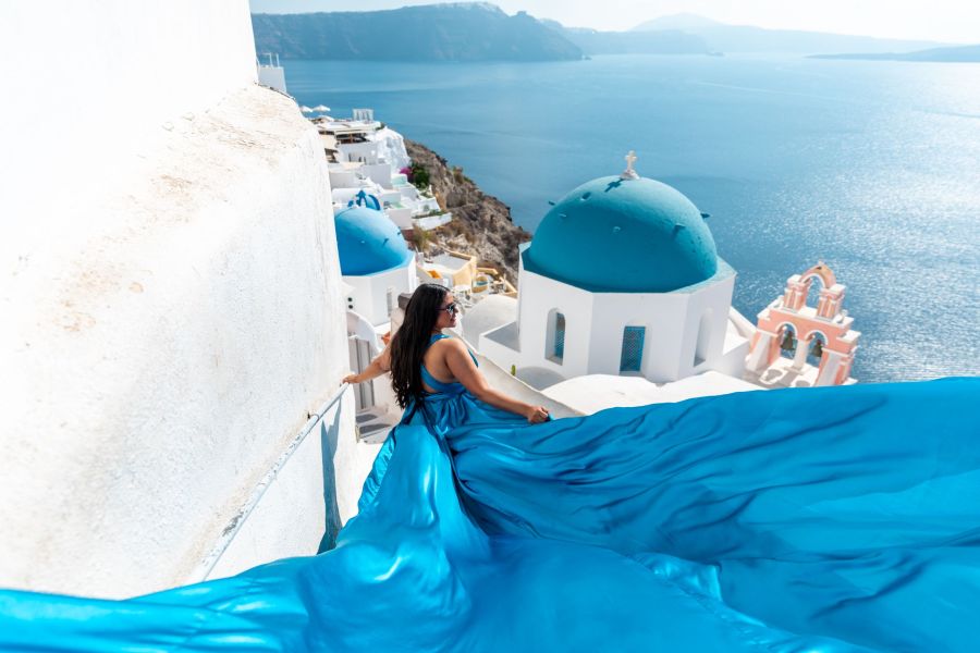 Santorini Photoshoot with a flying dress with long trail